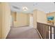 Hallway with carpet flooring and a railing overlooking the living room at 6088 Gulf Island Ave, Las Vegas, NV 89156