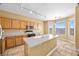 Eat-in kitchen features center island, stainless steel appliances and bright countertops at 6088 Gulf Island Ave, Las Vegas, NV 89156