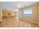 Open floor plan with spacious kitchen, eat-in bar, and tile flooring at 6088 Gulf Island Ave, Las Vegas, NV 89156