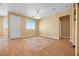 Bright living room with hardwood floors and large windows, offering a welcoming space at 6088 Gulf Island Ave, Las Vegas, NV 89156