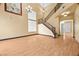 Bright living room with beautiful staircase, laminate flooring, and natural light at 6088 Gulf Island Ave, Las Vegas, NV 89156