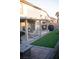 Outdoor living space featuring covered patio and low maintenance turf at 6141 Annville Ct, North Las Vegas, NV 89081