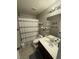Bathroom featuring a shower with curtain, light fixtures, vanity and decor at 6141 Annville Ct, North Las Vegas, NV 89081