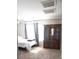Cozy bedroom with an antique hutch, large window, and a comfortable bed at 6141 Annville Ct, North Las Vegas, NV 89081