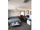 Bright bedroom featuring carpet flooring, neutral walls, and a ceiling fan at 6141 Annville Ct, North Las Vegas, NV 89081