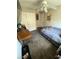 This is a bedroom featuring an accent wall, ceiling fan, and carpet flooring at 6141 Annville Ct, North Las Vegas, NV 89081