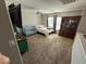 Bright bedroom features carpeted floors, ceiling fan, crib, and large cabinet at 6141 Annville Ct, North Las Vegas, NV 89081