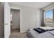 Comfortable bedroom with neutral walls and carpet and view to other rooms at 6141 Annville Ct, North Las Vegas, NV 89081