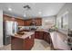 A stunning kitchen boasting stainless steel appliances, wood cabinets, and ample counter space at 6141 Annville Ct, North Las Vegas, NV 89081