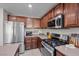 Updated kitchen featuring stainless steel appliances and ample counter space for cooking and entertaining at 6141 Annville Ct, North Las Vegas, NV 89081