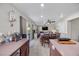 Modern kitchen leading to dining area, with backyard access, perfect for indoor/outdoor living and entertaining at 6141 Annville Ct, North Las Vegas, NV 89081