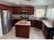 Bright kitchen with an island, stainless steel appliances, and plenty of counter space at 6141 Annville Ct, North Las Vegas, NV 89081