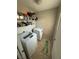 Efficient laundry room features a modern washer and dryer with overhead shelving at 6141 Annville Ct, North Las Vegas, NV 89081