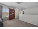 Cozy living room with large window and classic wood cabinet at 6141 Annville Ct, North Las Vegas, NV 89081