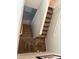 Carpeted staircase with white railings and neutral-colored walls leading upstairs at 6141 Annville Ct, North Las Vegas, NV 89081