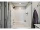 Bright bathroom features a tiled shower over tub and updated fixtures at 6228 Haiku Stairs St, Las Vegas, NV 89148