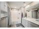 Bright bathroom features a tiled shower over tub and dual sink vanity at 6228 Haiku Stairs St, Las Vegas, NV 89148