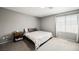 Neutral toned bedroom features a queen bed and large window at 6228 Haiku Stairs St, Las Vegas, NV 89148