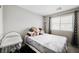 Neutral bedroom with accent pillows and good natural light at 6228 Haiku Stairs St, Las Vegas, NV 89148