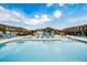 Sparkling community pool perfect for relaxation with ample seating, landscaping and covered lounge area for residents at 6228 Haiku Stairs St, Las Vegas, NV 89148