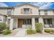 Charming townhouse featuring a covered porch, neutral stucco, and well-maintained landscaping at 6228 Haiku Stairs St, Las Vegas, NV 89148