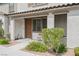 Inviting front porch with seating area enhances the curb appeal of this well-maintained townhome at 6228 Haiku Stairs St, Las Vegas, NV 89148