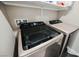 Modern laundry room featuring a front-load washer and dryer at 6228 Haiku Stairs St, Las Vegas, NV 89148