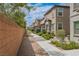 Well-maintained townhomes showcasing manicured lawns and inviting sidewalks, perfect for a peaceful stroll at 6228 Haiku Stairs St, Las Vegas, NV 89148
