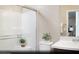 Bright secondary bathroom featuring a glass shower, white vanity, and modern fixtures and finishes at 627 Bellus Pl # Lot 156, Henderson, NV 89015