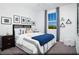 Bright secondary bedroom with modern decor, a comfortable bed, and views of the surrounding landscape at 627 Bellus Pl # Lot 156, Henderson, NV 89015