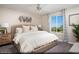 This modern bedroom features neutral walls, carpeted floors, a ceiling fan, and a window with curtains at 627 Bellus Pl # Lot 156, Henderson, NV 89015