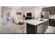 Open-concept kitchen and great room featuring stainless steel appliances, white countertops, and ample seating at 627 Bellus Pl # Lot 156, Henderson, NV 89015