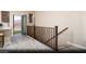 Bright living area with light wood floors, stairs and a view of the outdoors from an adjacent balcony at 627 Bellus Pl # Lot 156, Henderson, NV 89015