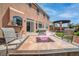 Beautiful backyard with a fire pit, built-in grill, and a covered patio, perfect for entertaining at 6453 Mount Eden Ave, Las Vegas, NV 89139