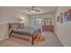 Cozy bedroom featuring a comfortable bed, neutral walls, and a large window at 6453 Mount Eden Ave, Las Vegas, NV 89139