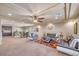 Large bonus room with a ceiling fan, comfortable seating, and wet bar at 6453 Mount Eden Ave, Las Vegas, NV 89139