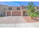 Elegant two-story home featuring a three-car garage, tile roof, and well-maintained landscaping at 6453 Mount Eden Ave, Las Vegas, NV 89139