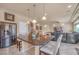 Open kitchen with granite island, stainless steel fridge, and access to a living area at 6453 Mount Eden Ave, Las Vegas, NV 89139