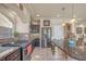 Well-equipped kitchen featuring a gas range, stainless refrigerator, and granite countertops at 6453 Mount Eden Ave, Las Vegas, NV 89139