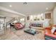 Bright living room with tile floors, fireplace, and view to dining area at 6453 Mount Eden Ave, Las Vegas, NV 89139