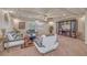 Spacious living room with decorative ceiling, stylish furnishings, and natural light at 6453 Mount Eden Ave, Las Vegas, NV 89139