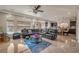 Spacious living room with a large sectional, tile floors, and open layout at 6453 Mount Eden Ave, Las Vegas, NV 89139