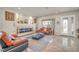 Inviting living room with a modern fireplace, tile floors, and stylish decor at 6453 Mount Eden Ave, Las Vegas, NV 89139