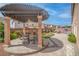 Inviting outdoor patio with a pergola, ceiling fan, seating, and a built-in grill at 6453 Mount Eden Ave, Las Vegas, NV 89139