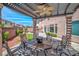 Outdoor living space featuring a pergola, ceiling fan, and comfortable seating at 6453 Mount Eden Ave, Las Vegas, NV 89139