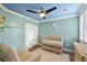 Well-lit baby's room with modern ceiling fan, paint, and furnishings at 6655 Flaminian Ln # 104, North Las Vegas, NV 89084