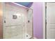 Bathroom showcasing tiled shower with glass doors and modern finishes at 6655 Flaminian Ln # 104, North Las Vegas, NV 89084