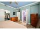 Comfortable bedroom with closet, blue ceiling and entrance to the bathroom at 6655 Flaminian Ln # 104, North Las Vegas, NV 89084