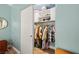 Bedroom closet includes shelving and storage space with hanging clothes at 6655 Flaminian Ln # 104, North Las Vegas, NV 89084