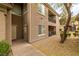 Inviting condo exterior with well-maintained landscaping, neutral tones, and a private entrance at 6655 Flaminian Ln # 104, North Las Vegas, NV 89084